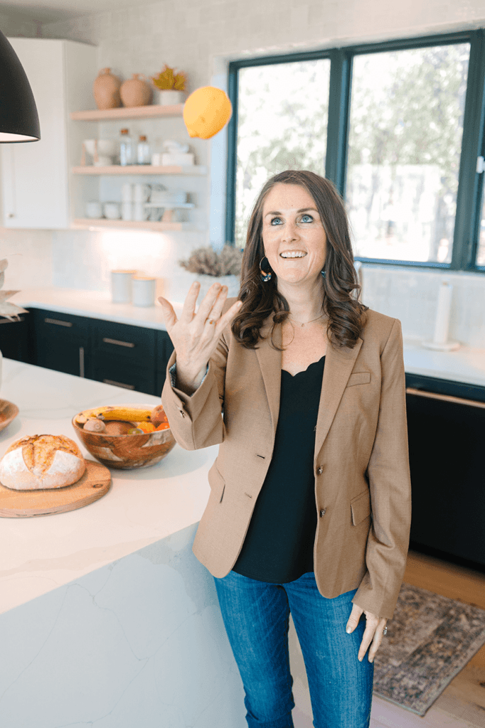 Dr. Heather Finley throwing an orange